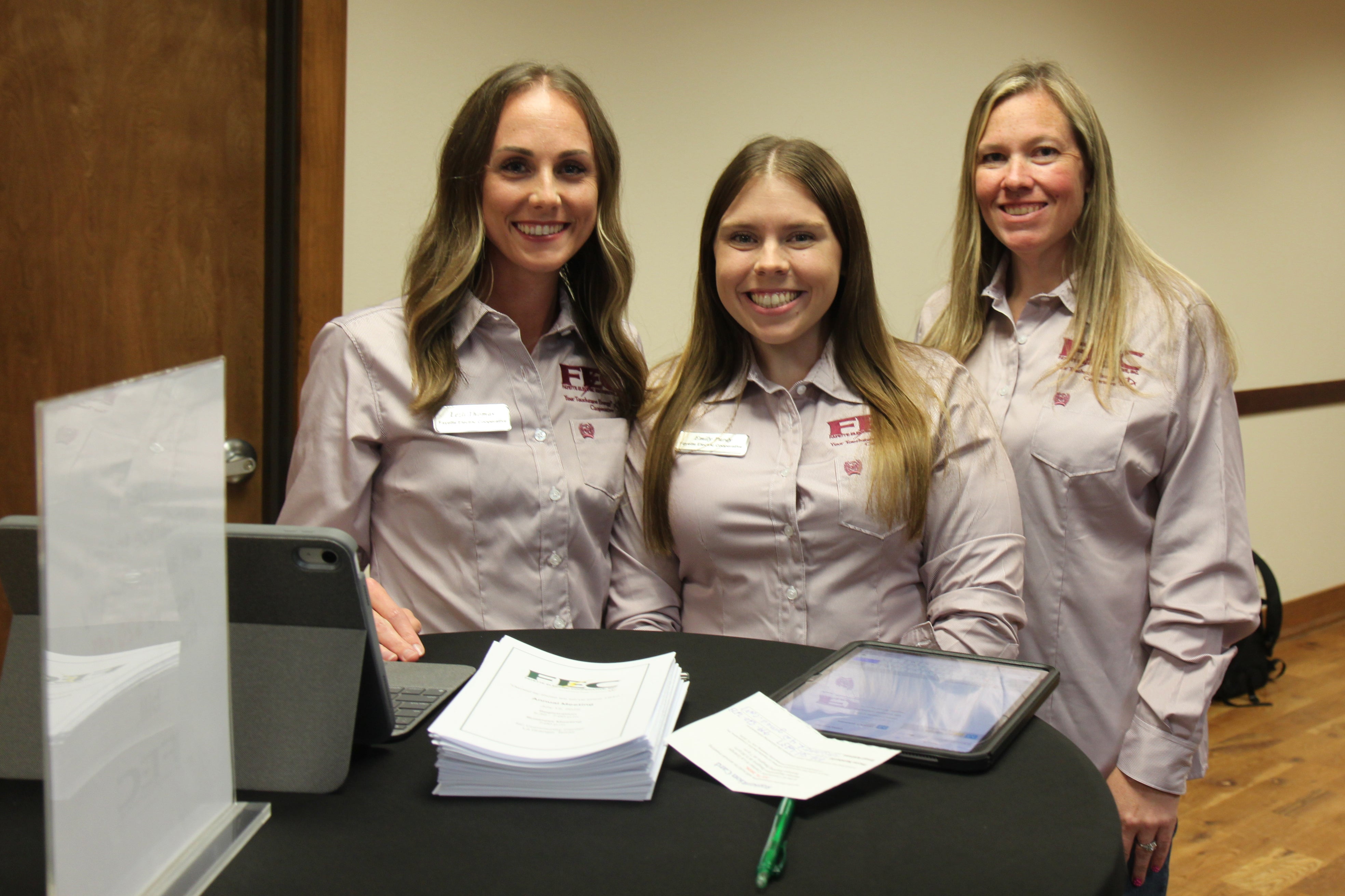 Lezli, Emily & Amanda wait to register members and guests