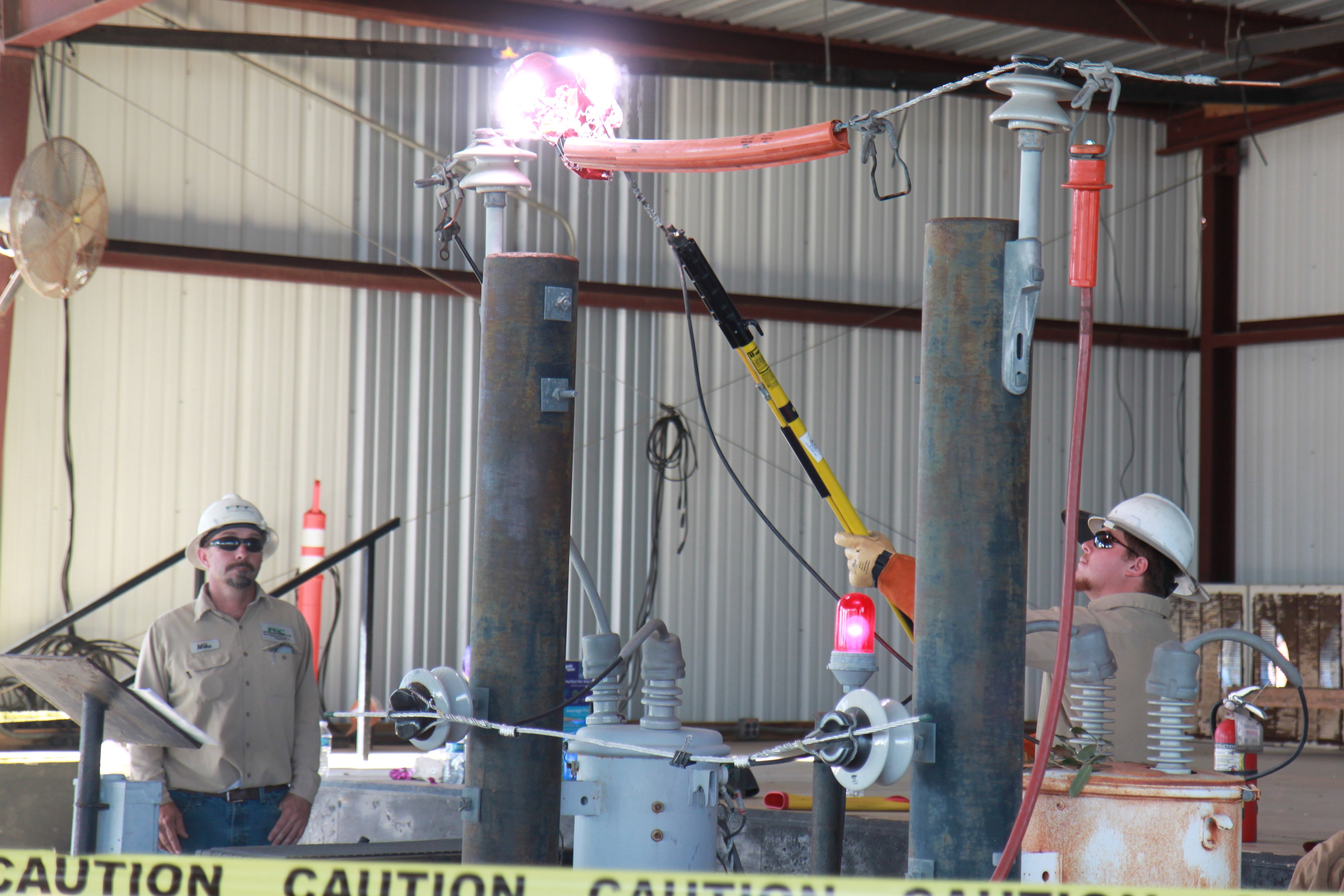 Mike Proske and Mason Saleman demonstrate the dangers of electricity